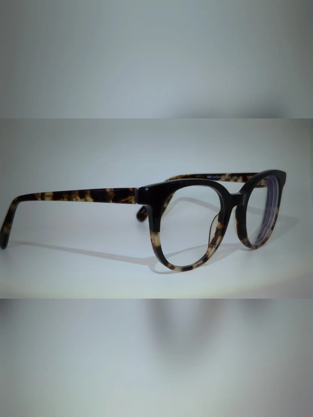 Rialto. Classic Round Black Upper, Animal Print Lower And Temples.
